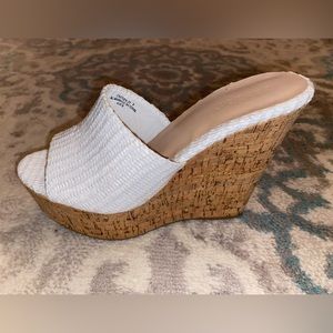 Bamboo wedge sandals . Never worn!! Heel height 3.5 inches.